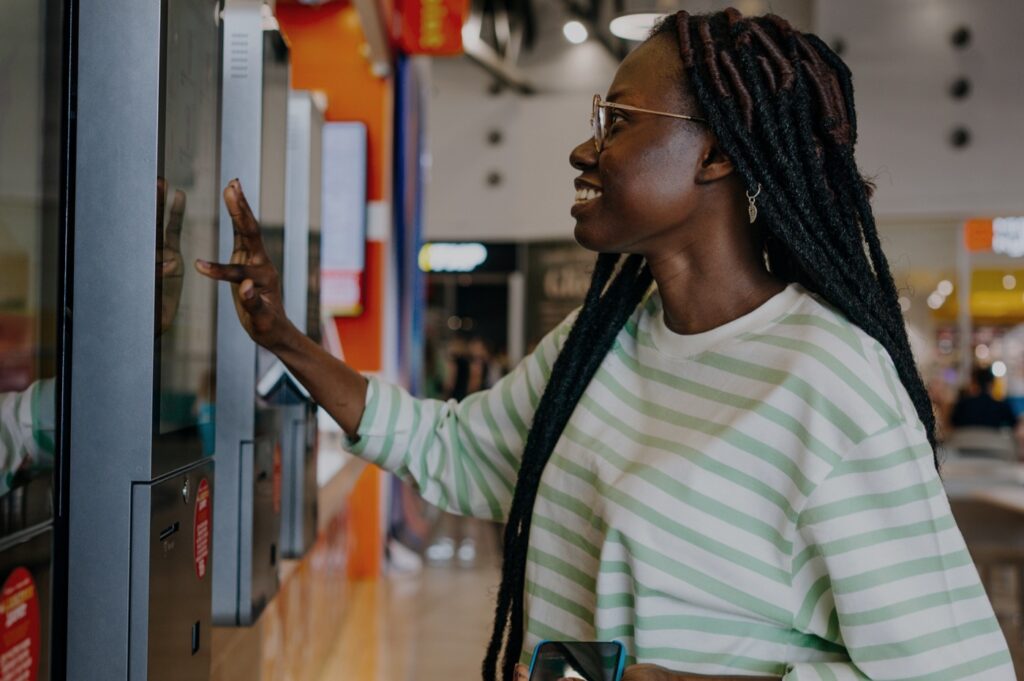Woman using a large touch screen